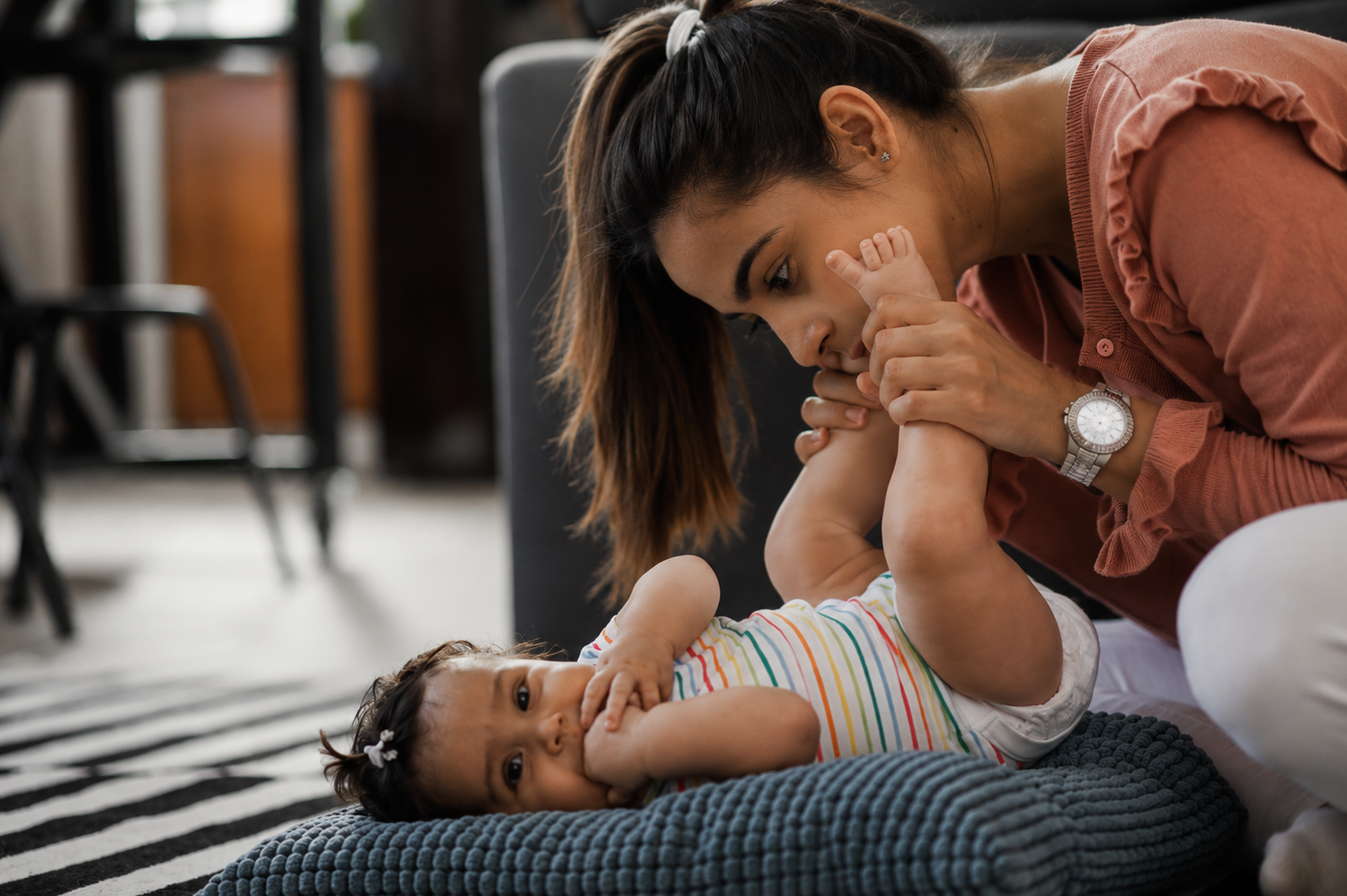 Caregiver supporting a new mother and baby